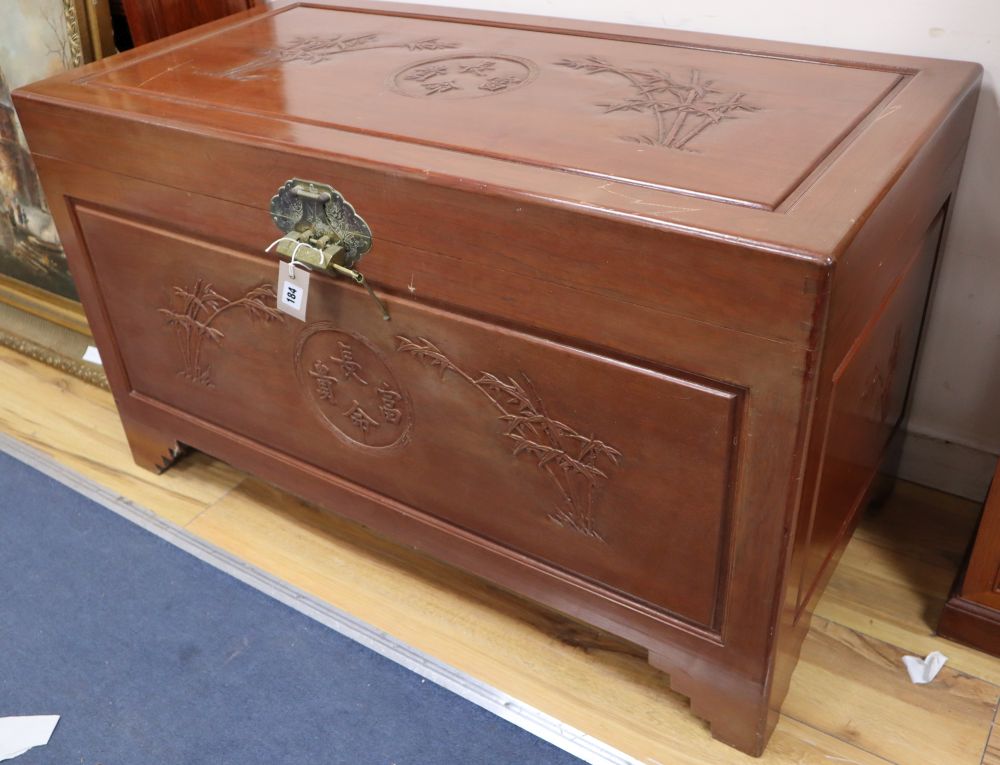 A Chinese hardwood and camphor carved chest, width 103cm, depth 53cm, height 60cm